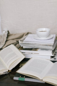 Piles of books with coffee