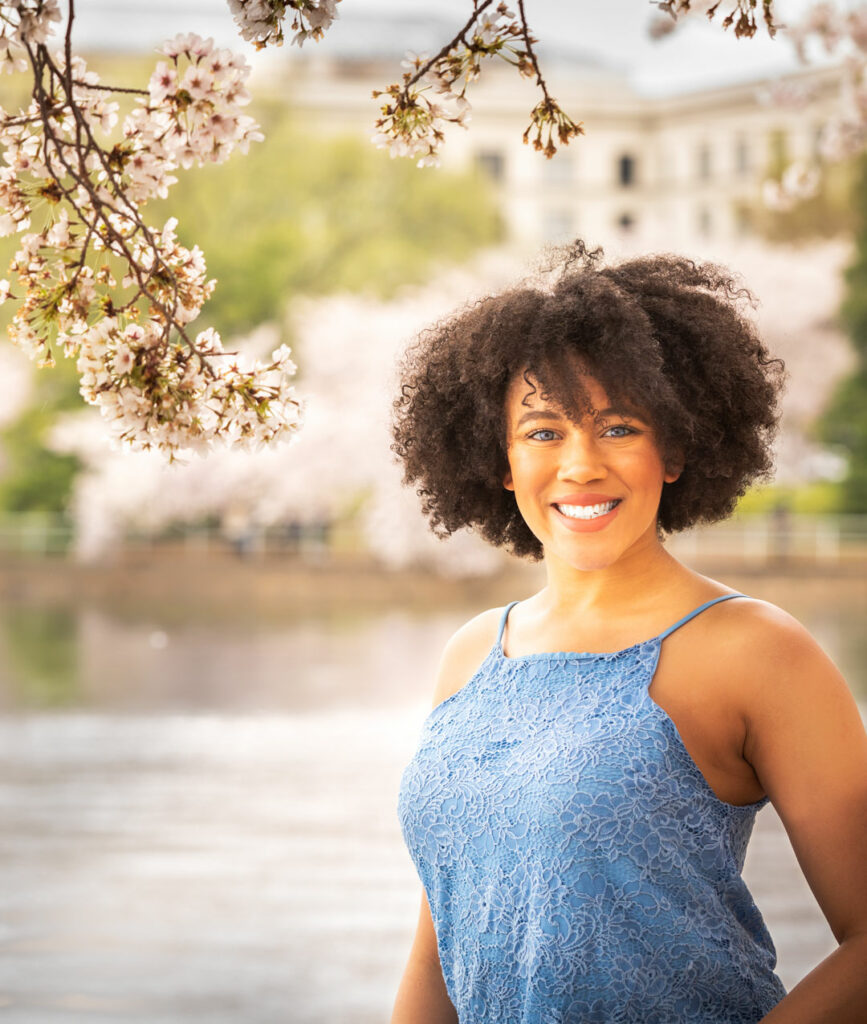 Female with black hair at Jefferson Memorial Tidal Basin in Washington DC during a Cherry Blossom photography session