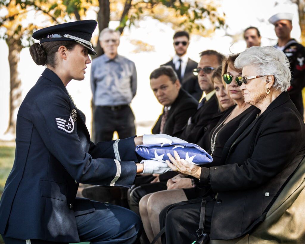 soldiers folding American flag at Arlington National Cemetery